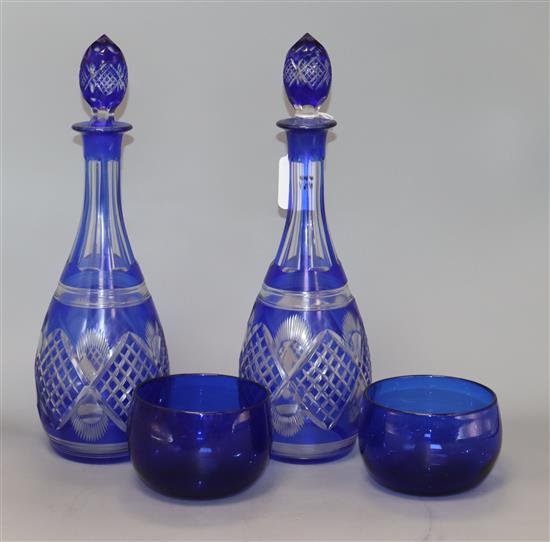 A pair of overlay blue decanters and two blue rinsers